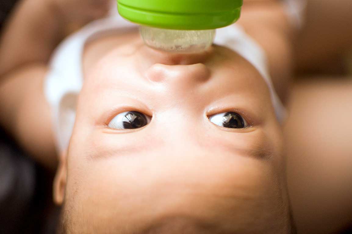 Bottle feed a baby