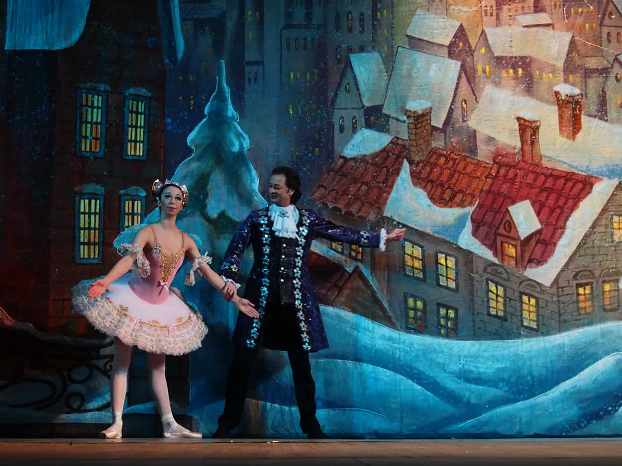 Godfather and magic doll during the Nutcracker Ballet