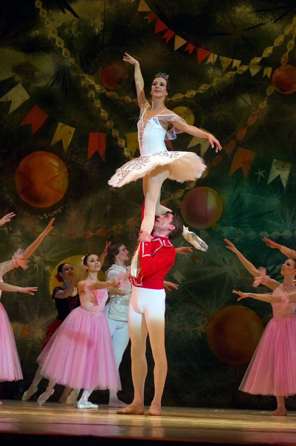 Nutcracker ballet characters- the nutcracker lifting the Sugar Plum Fairy