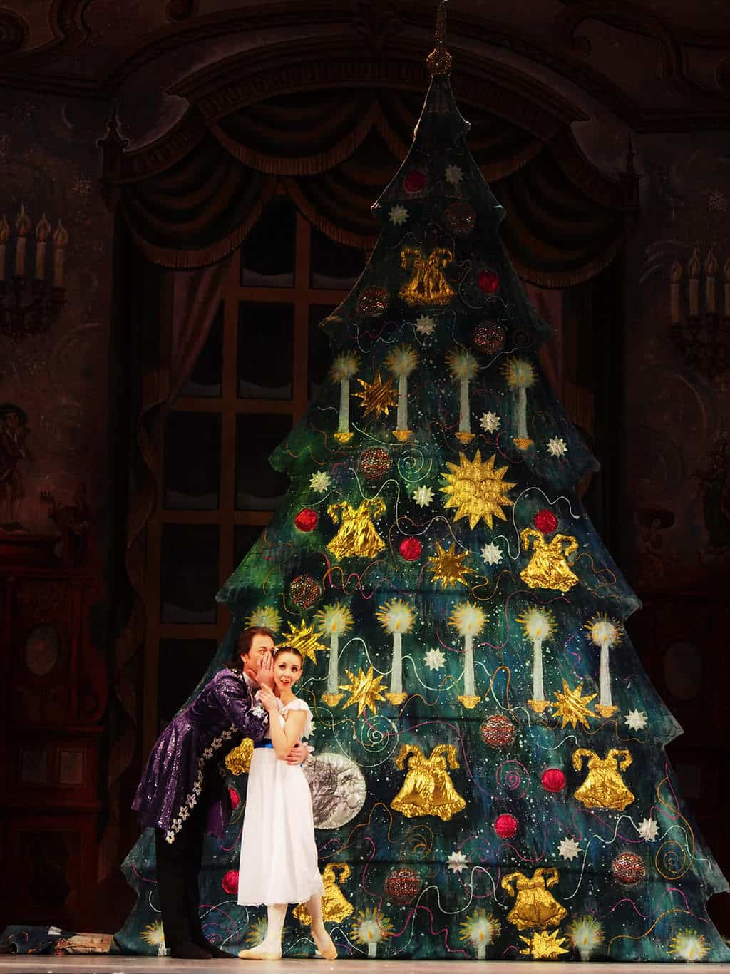 Clara and her godfather on stage during the Nutcracker Ballet