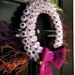 DIY Halloween Crafts- create this beautiful Halloween Eyeball Wreath that is sure to wow all of your neighbors this holiday season. This cheap Halloween project is easy to do with kids and won't break your bank account but will look like a million bucks. #halloween