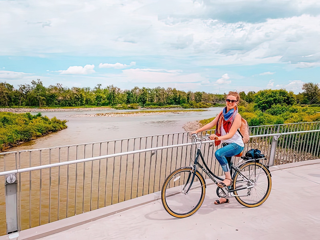 What to Do in Calgary: A Girls' Trip Guide to Alberta's Most Underrated City 10 Keryn biking the Bow River Pathway