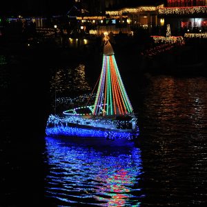 Boat with lights on it at the Huntington Beach Cruise of Lights during Christmas in California