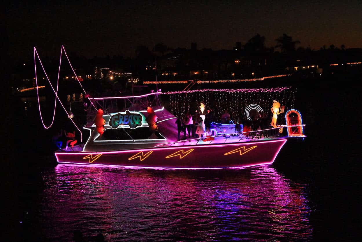 Boat with lights on it at the Huntington Beach Cruise of Lights during Christmas in California