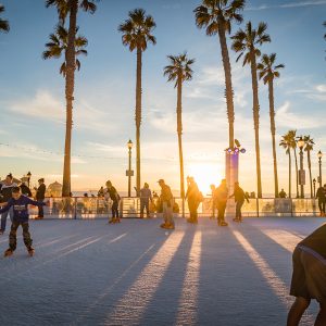Ice skaters at the Surf City Winter Wonderland Ice Rink in Huntington Beach CA during Christmas