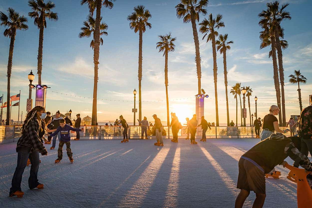 Ice skaters at the Surf City Winter Wonderland Ice Rink in Huntington Beach CA during Christmas