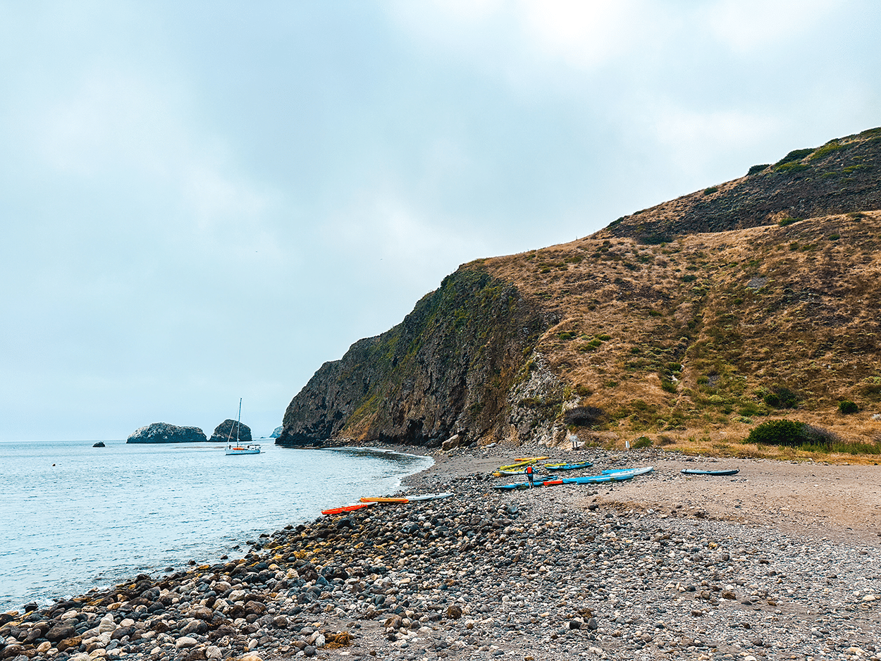 Kayaks on the beach before we take off on our Channel Islands kayaking adventure - photo credit Keryn Means Twist Travel Magazine