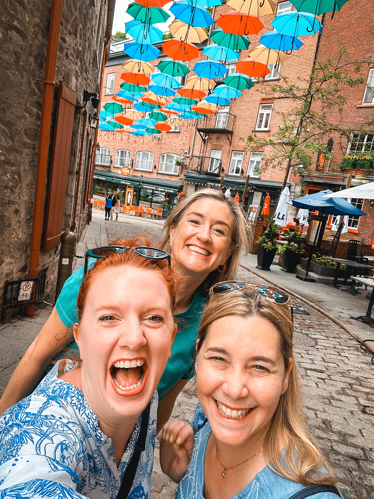 Quebec City 4-Day Itinerary: A Girls’ Getaway Guide 4 Umbrella alley with Claudia and Katja- credit Keryn Means, TwistTravelMag.com