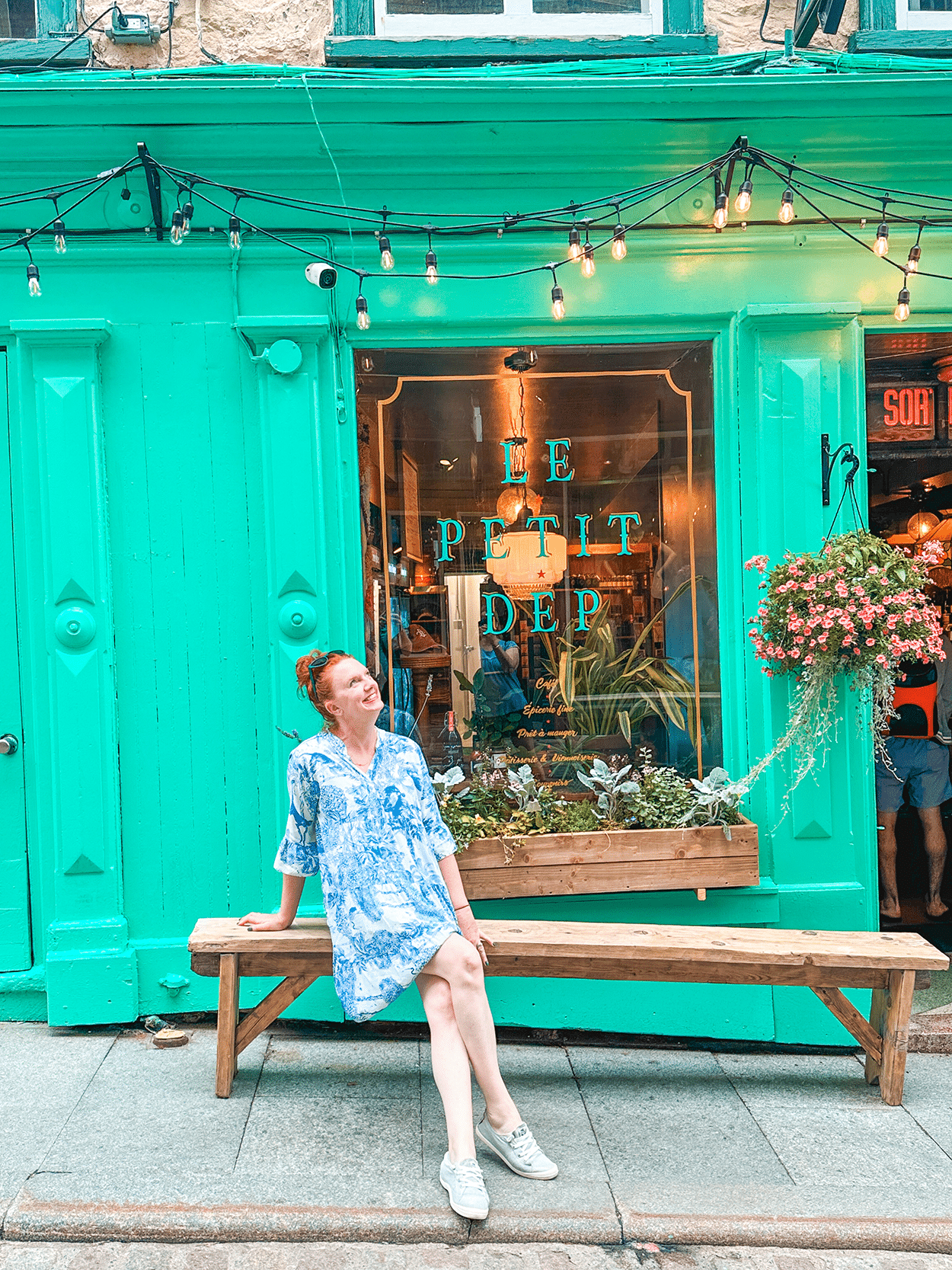 Quebec City 4-Day Itinerary: A Girls’ Getaway Guide 29 Keryn in front of Le Petit Dep coffee shop- photo by Keryn Means Twist Travel Magazine