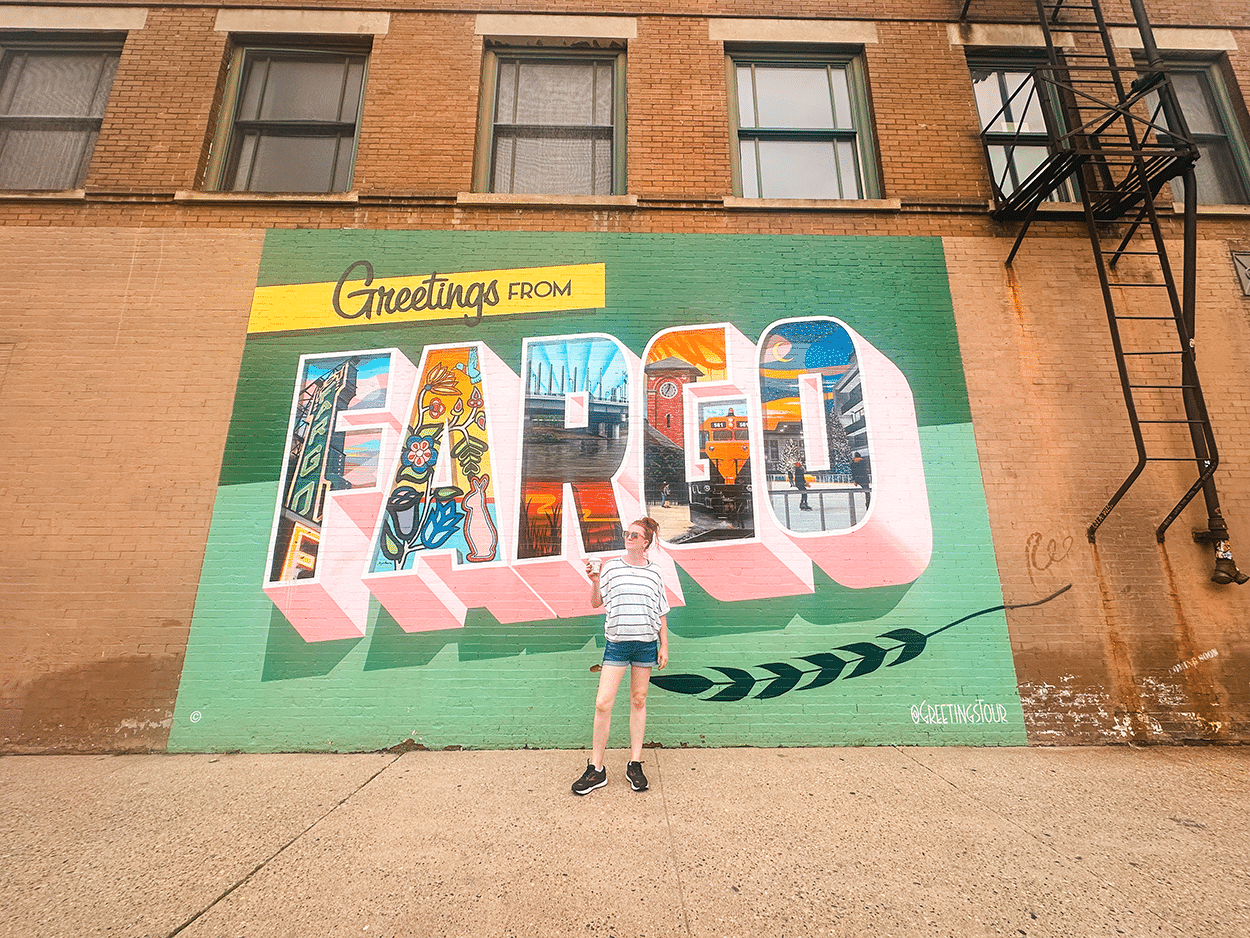 3-Day Girls’ Trip to Fargo, ND: Cocktails, Boutiques & Broadway Favorites 77 Greetings from Fargo mural in Fargo NOrth Dakota