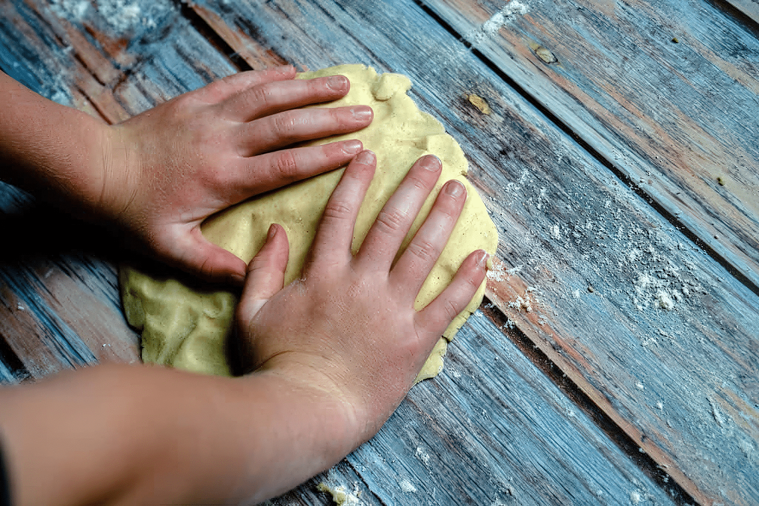 Mojo Pork Empanadas Recipe That's Worth the Effort 4 Little hands helping to make empanada dough